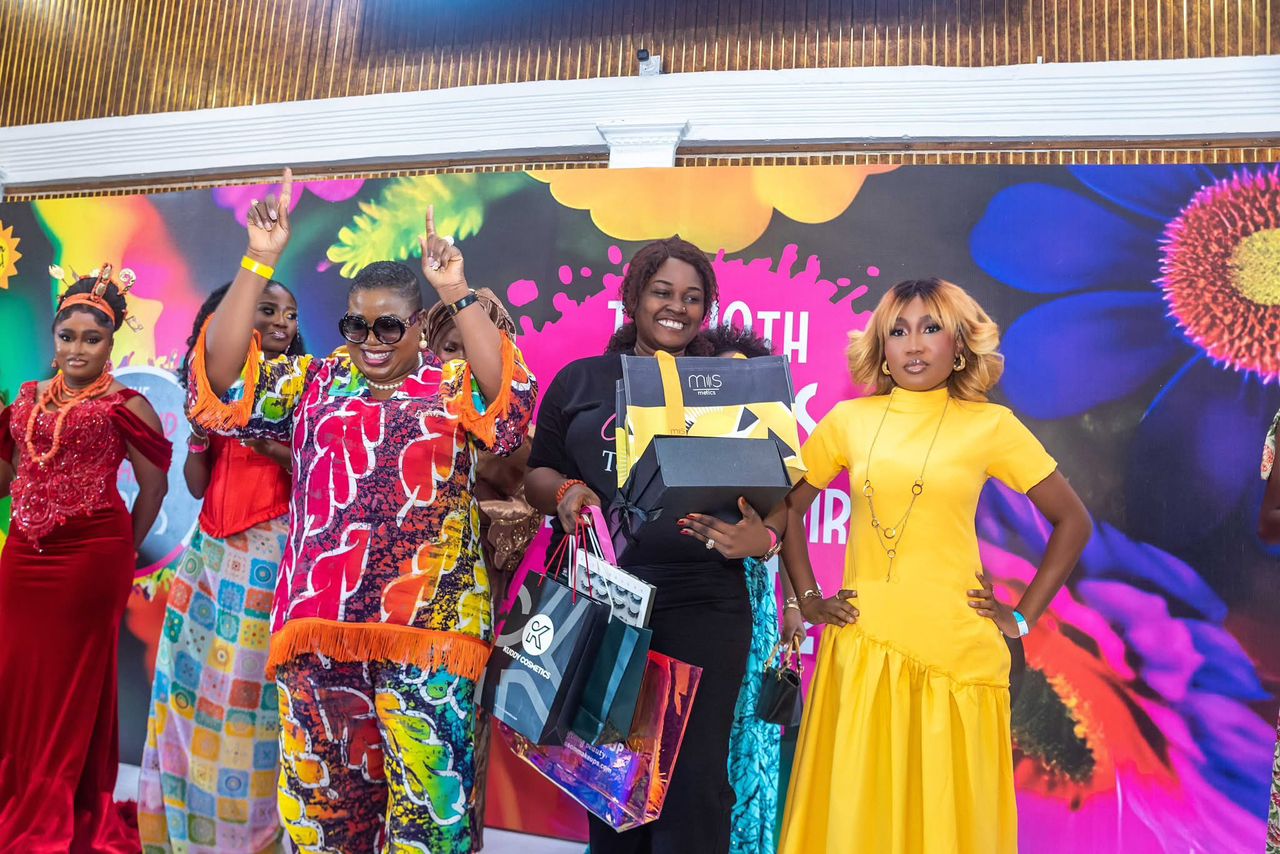 Winner celebrating with her prize box at the 19th Lagos Makeup Fair