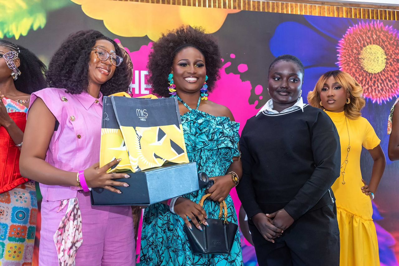 BFOC winner receiving her prize box on stage